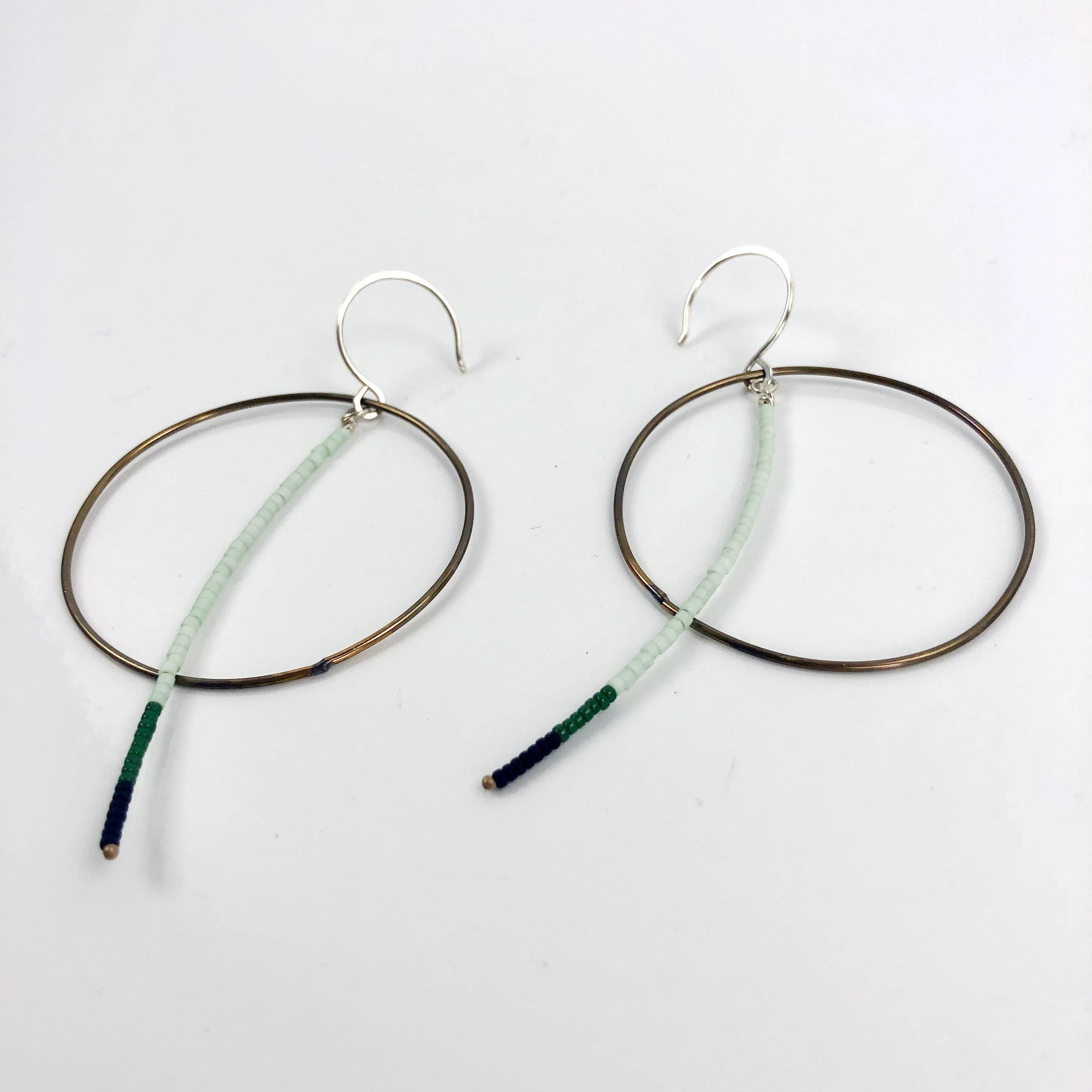 Olivia de Soria Earrings: Brass Circular Beaded Line