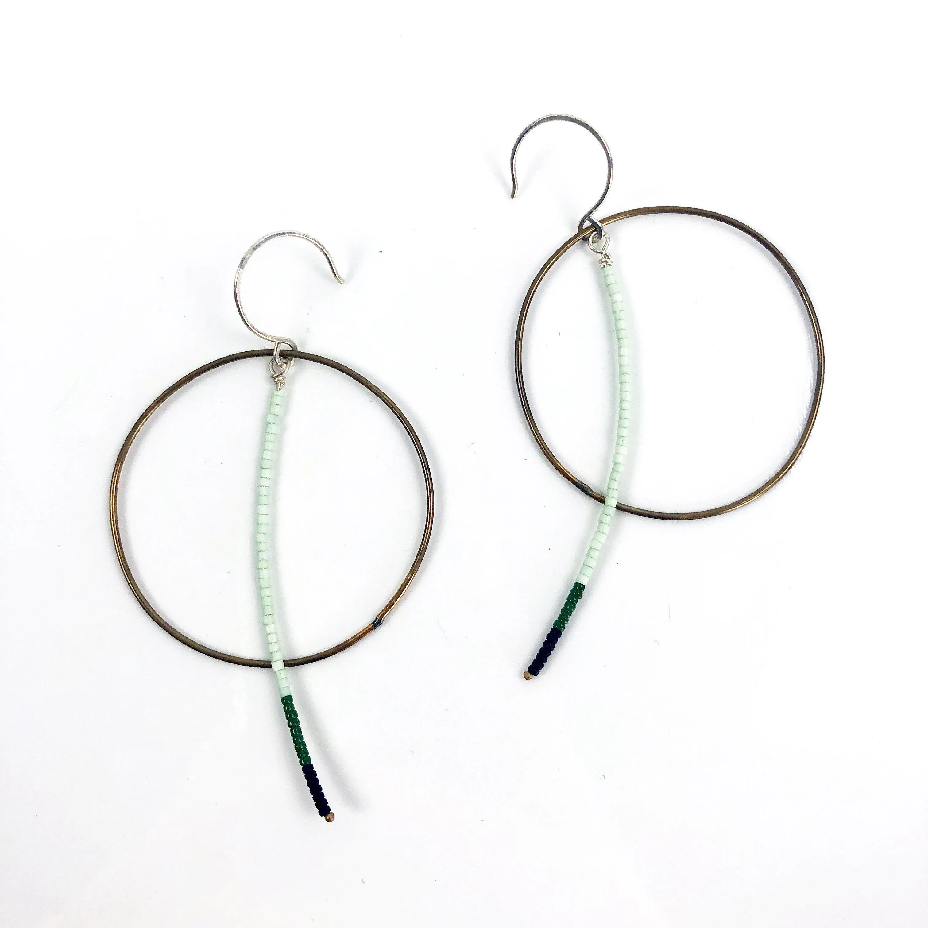 Olivia de Soria Earrings: Brass Circular Beaded Line