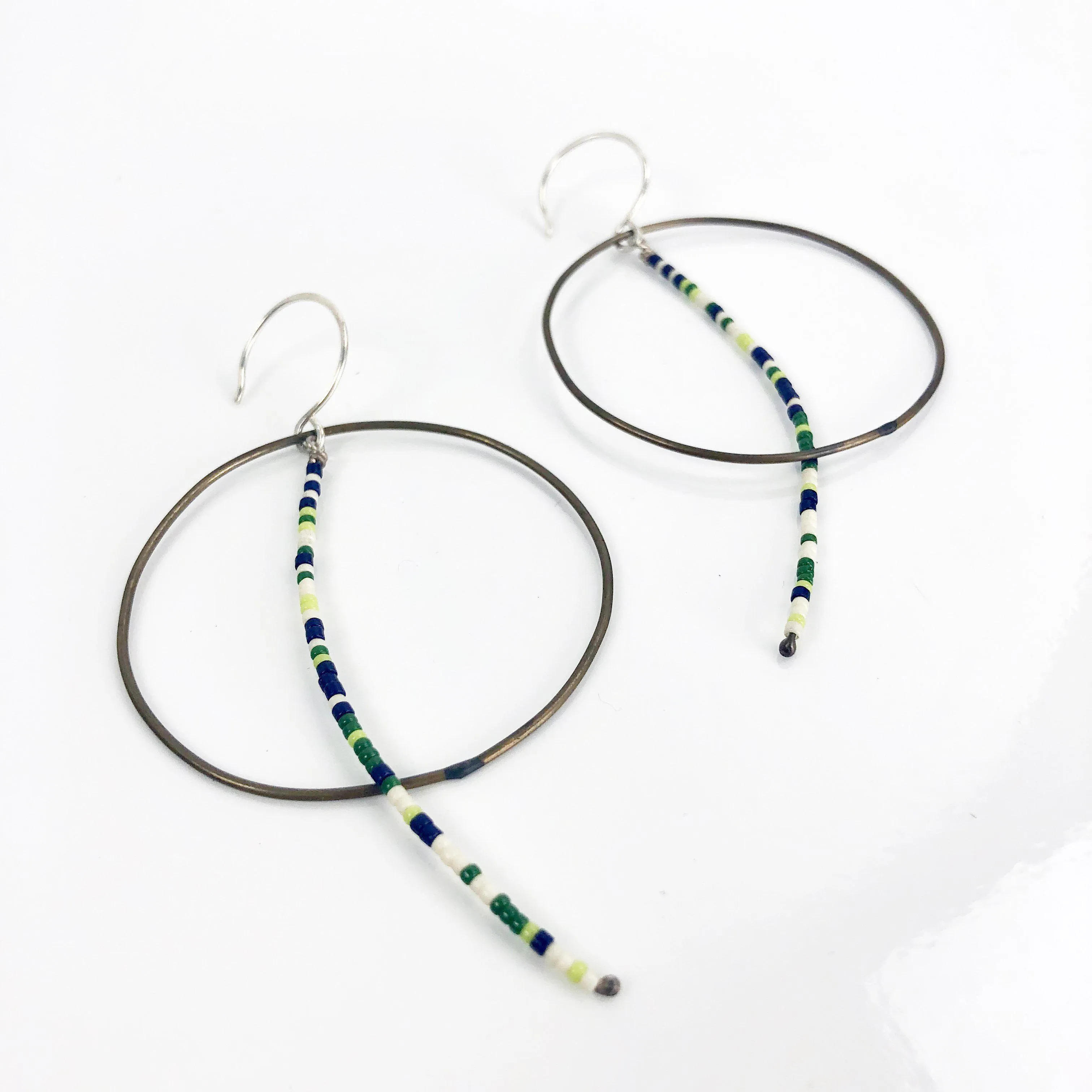Olivia de Soria Earrings: Brass Circular Beaded Line