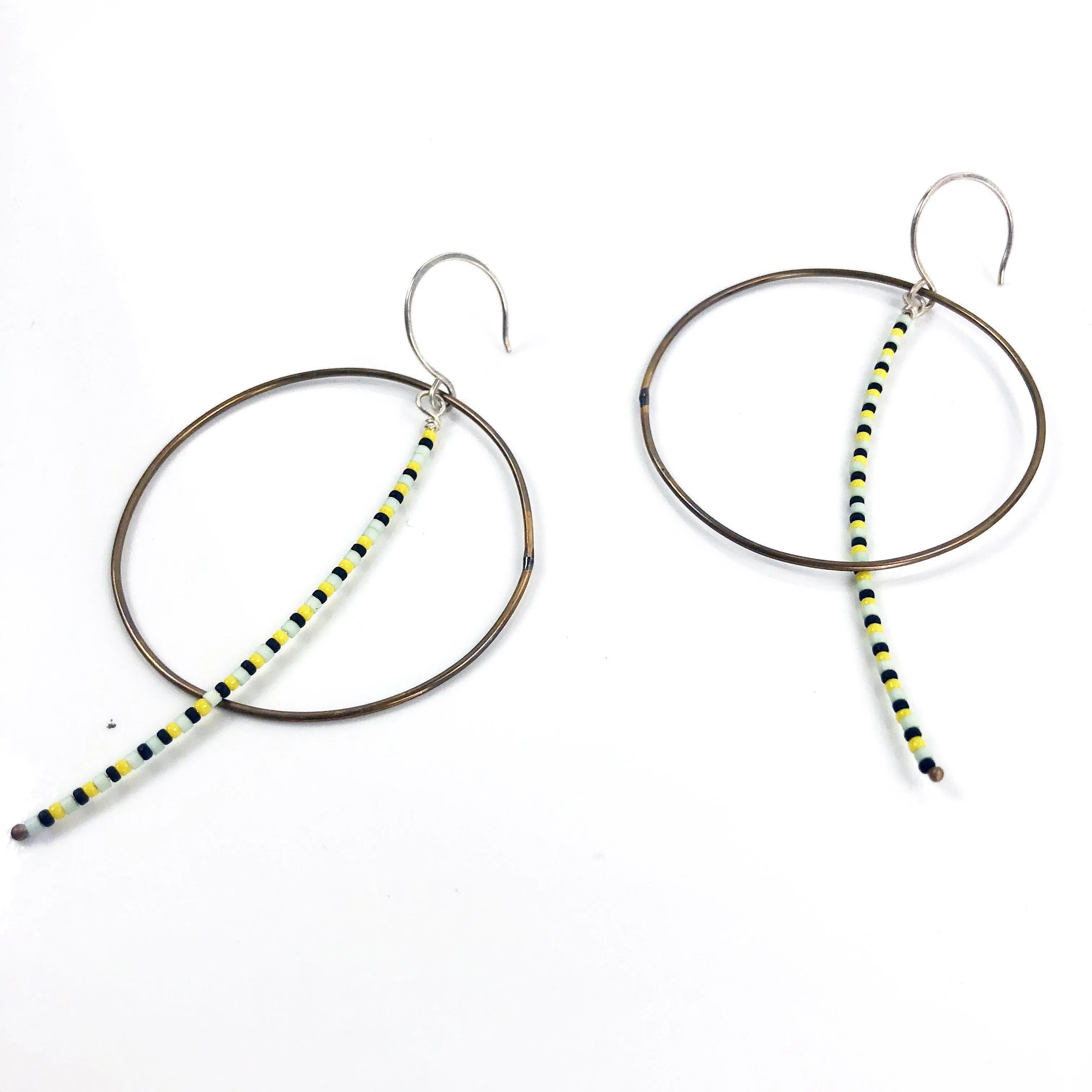 Olivia de Soria Earrings: Brass Circular Beaded Line